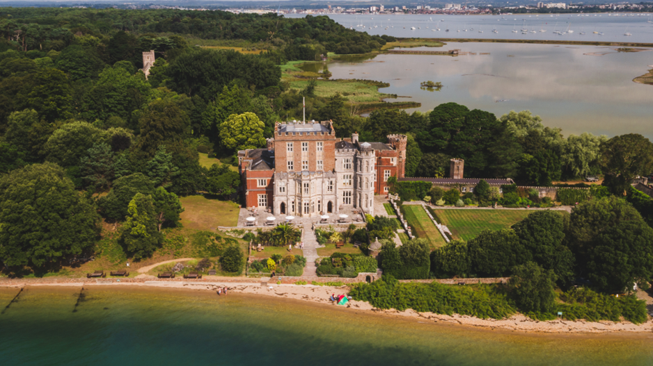 Brownsea castle from a drone point of view surrounded by water