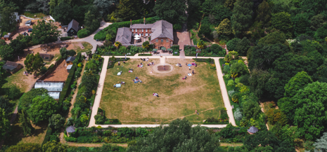 Aerial view of Upton Country Park, grass and building in view