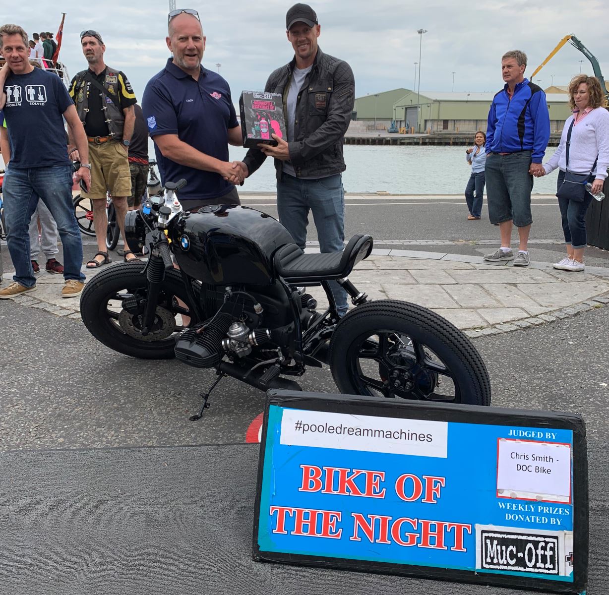 Bike Night Winner pictured on Poole Quay with winning motorbike