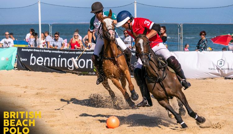 Two jockeys contesting the ball during the Sandpolo event at Sandbanks